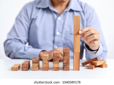 Businessman And Wooden Toy Block, Different Concept