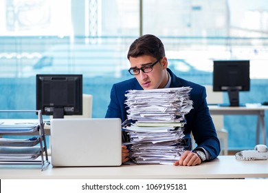 Businessman Workaholic Struggling With Pile Of Paperwork