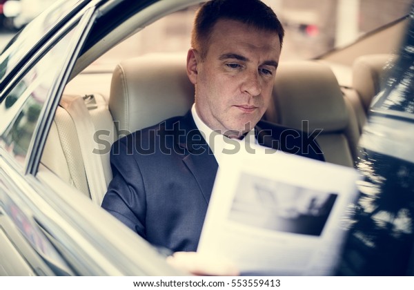 Businessman Working Busy Car\
Inside