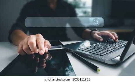 The businessman working with a computer laptop on a desk in the office. The concept is Search engine Browsing Internet Data Information with a blank search bar. Search Engine SEO Networking. - Shutterstock ID 2036111951