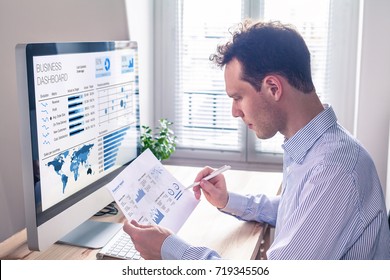 Businessman working with dashboard and key performance indicator (KPI) metrics, business intelligence (BI) graph and charts and financial report data with computer in office