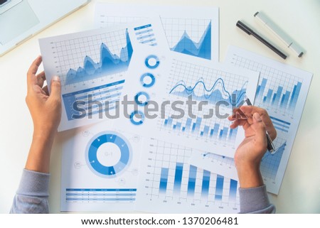 businessman working data document graph chart report marketing research development  planning management strategy analysis financial accounting. Business  office concept.