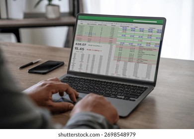 businessman working with data and graphs in spreadsheet documents for online analysis Microsoft Excel project dashboard accounting digital