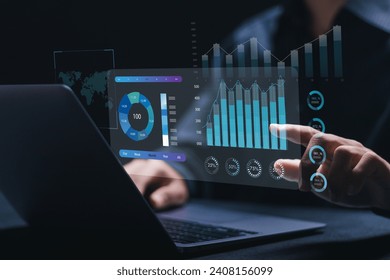 Businessman working with data management system on computer to make report with KPI and metrics connected to database. finance, operations, sales, marketing, KPI, business performance indicators.