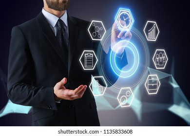 Businessman Working With Digital Touch Screen With Multimedia Icons On Abstract Background. Management Concept