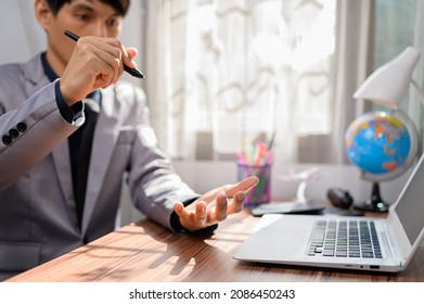 businessman working in front of a notebook computer at a desk