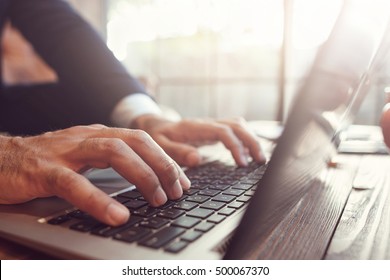 Businessman Working At Laptop. Unrecognizable Man Typing Text On The Keyboard. Business, Work, Author, Writer, Creative Concept