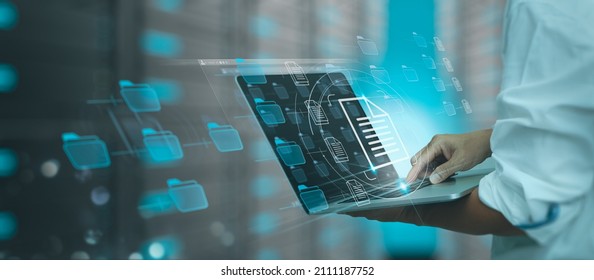 Businessman working modern compter Document Management System (DMS),Virtual online documentation database and process automation to efficiently manage files, knowledge and documentation enterprise - Shutterstock ID 2111187752