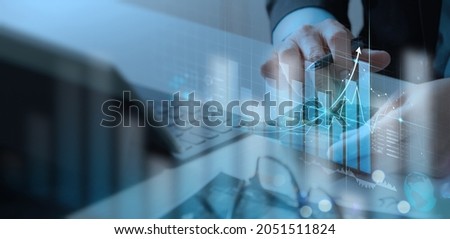 Businessman working with modern computer calculator virtual dashboard analyzing finance sales data and economic growth graph chart and  account report technology.
