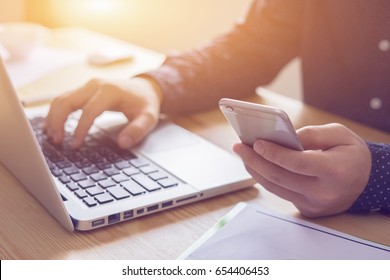 businessman working with modern devices, student boy using digital tablet computer and mobile smart phone,business concept,selective focus,vintage color - Shutterstock ID 654406453