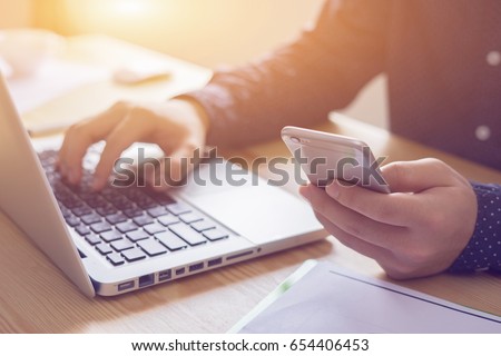 businessman working with modern devices, student boy using digital tablet computer and mobile smart phone,business concept,selective focus,vintage color