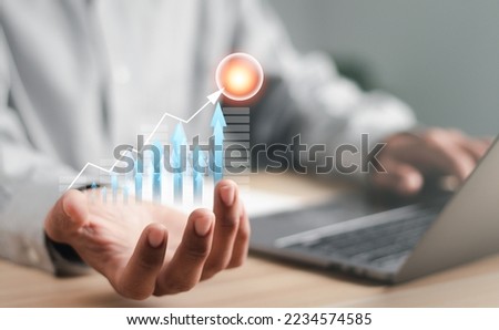 Businessman working with modern laptop computer. Planning and analyzing business and financial growth. Business incremental growth concept.