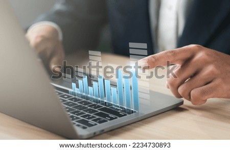 Businessman working with modern laptop computer. Planning and analyzing business and financial growth. Business incremental growth concept.