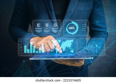 Businessman working at modern office. modern virtual interface. Digital diagram, graph interfaces, virtual screen. Man using modern tablet for business management according to esg principles