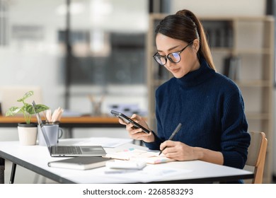 Businessman working at office with calculator documents phone laptop on desk, Asian woman doing planning analyzing the financial report, business plan investment, finance analysis concept