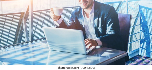 Businessman Working On Computer, Drinking Coffee And Smiling, Abstract Business Banner Background With Place For Text