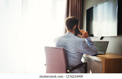 Businessman Working On Computer In Hotel Room