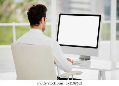 Businessman Working On Computer In Office