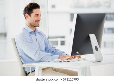 Businessman Working On Computer In Office