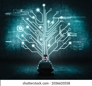 Businessman working on his laptop in front of a wall with a circuit board tree . The concept of working on a network