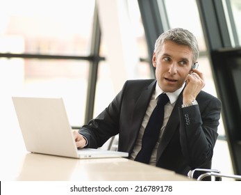 A Businessman Working On His Laptop.