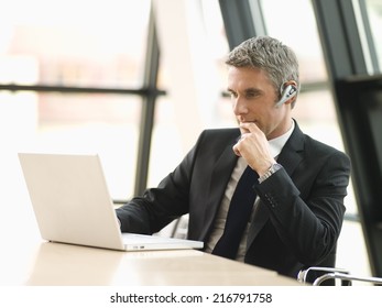 A Businessman Working On His Laptop.