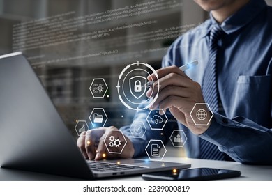 Businessman working on laptop with cyber security network.  Padlock icon and internet technology networking. - Powered by Shutterstock - Get 15% off with code: PIKWIZARD15