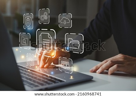 Businessman working on laptop with document management icon, Online document file management, database technology concept.