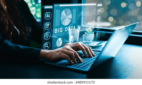 Businessman working on a laptop with a holographic interface for big data analytics, artificial intelligence, data management, and strategic decision making. Enhancing efficiency, driving innovation - Powered by Shutterstock