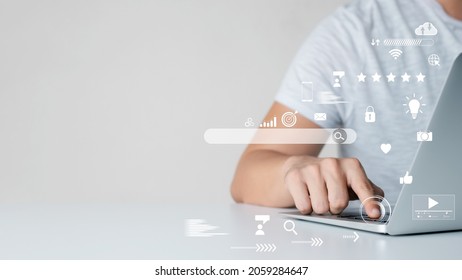 businessman Are working on the laptop keyboard to use the search engine optimization tool. To find customers or promote and advertise online content for technology, marketing, and business concept. - Shutterstock ID 2059284647