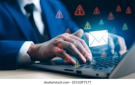 A Businessman working on a laptop open an email with triangle caution warning sign for notification error and maintenance concept, network security, computer virus detected, personal data protection.