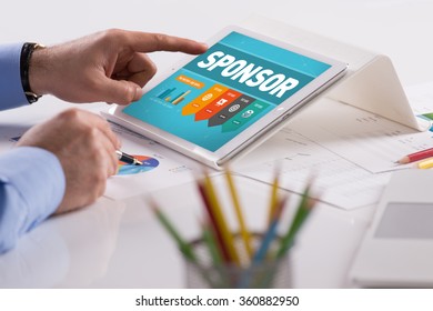 Businessman working on tablet with SPONSOR on a screen