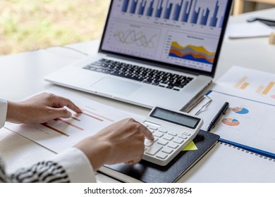 Businessman Working In A Private Office, She Is Reviewing The Company's Financial Documents Sent From The Finance Department Before He Takes It To A Meeting With A Business Partner. Financial Concept.