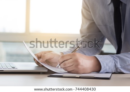 Businessman working reading documents graph financial to job succes Analyze document plans