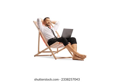 Businessman working remotely seated on a beach chair with a laptop computer isolated on white background - Powered by Shutterstock