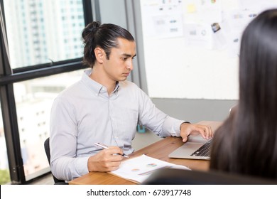 Businessman Working With Serious Emotion While Team Meeting  At Office Place, Man Working With Team Concept, 20-30 Year Old.