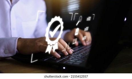 businessman working with the sign of the top service Quality assurance, Guarantee, Standards, ISO certification, and standardization quality control ISO 9001 ISO IEC 17025 concept. - Shutterstock ID 2155412557