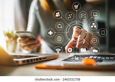  Businessman Working With Smart Phone And Laptop And Digital Tablet Computer In  Office With Digital Marketing Media  In Virtual Icon
