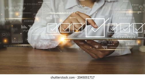 Businessman working with tablet. Checking mark up on the check boxes. Successful completion of business tasks. Digital marketing of statistics level up of graph. Business management goal strategy. - Shutterstock ID 2045051717