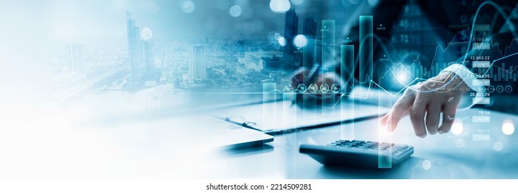 Businessman working with using a calculator to calculate the numbers of financial and analyzing sales data on economic growth graph chart, Banking and finance, Digital marketing and business strategy. - Shutterstock ID 2214509281