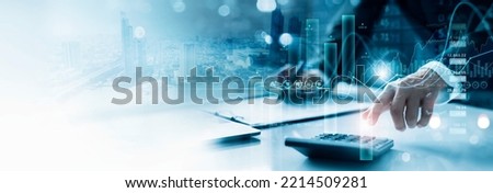 Businessman working with using a calculator to calculate the numbers of financial and analyzing sales data on economic growth graph chart, Banking and finance, Digital marketing and business strategy.