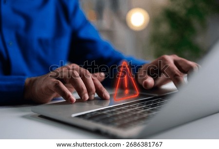 A Businessman working and using laptop computer with triangle caution warning sign for notification error and maintenance concept, network security, computer virus detected, personal data protection.