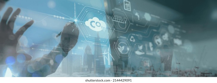 Businessman Working Virtual Modern Computer To Reduce CO2 Emissions Carbon Footprint Climate Change To Limit Global Warming.Sustainable Development And Innovation Green Business Concept.