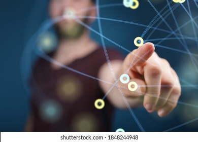 A businessman working with a virtual representation of organization network team networking - Shutterstock ID 1848244948