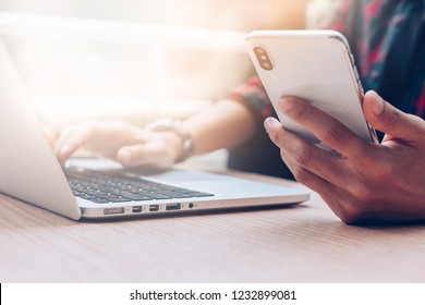 Businessman at workplace Think business investment plan.Contact Investor using cell phone,computer make note meeting of appointment information in the notebook.design creative work space - Shutterstock ID 1232899081
