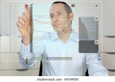 Businessman Works With Futureistic Computer Display