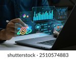 Businessman works on laptop Showing 2025 business trends dashboard with charts, metrics, AI, E-commerce, KPI. businessman planning business growth 2025. 2025 annual business plan and business strategy