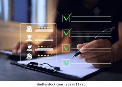A businessman write green check mark to online evaluating a vendor or supplier shop and rated a maximum of five stars according customer satisfaction experience