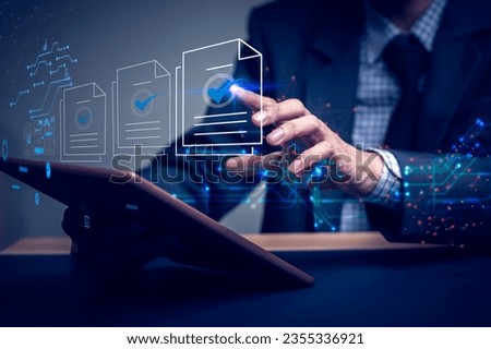 Businessman writes signing contract, designs, draws, or sketches projects through a tablet on the office desk. Hand concept stamp of approval on a public notarization certificate document electronic.	
