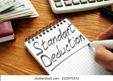 Businessman Writes Standard Deduction By Marker.